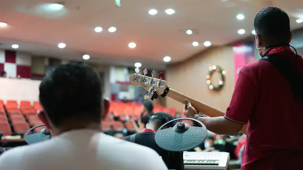 stock image Musicians Rehearsing for Christmas Performance, Church Drummer and Guitarist