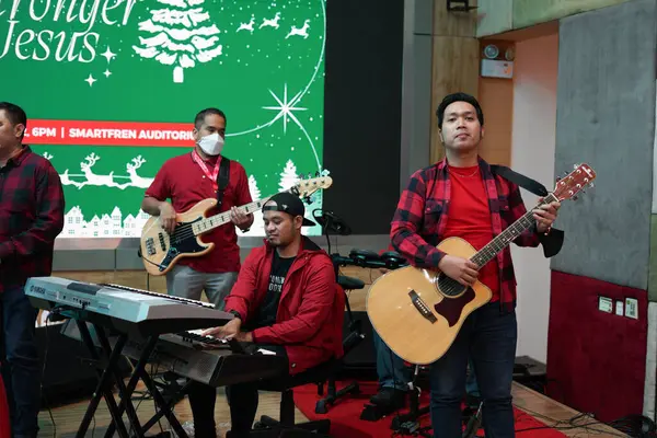stock image Musicians with Instruments Performing at Christmas Event Gathering