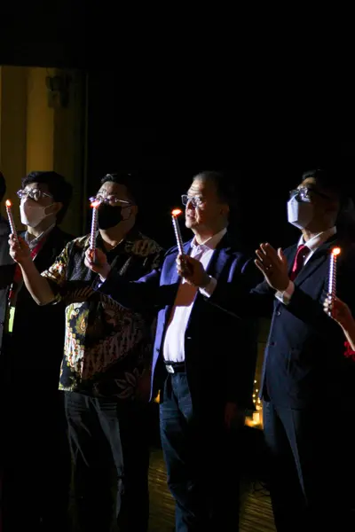 stock image Christmas Candlelight Service, Men in Suits Holding Candles Singing Holy Night