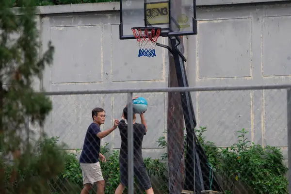 stock image Father and Son Playing Basketball in Outdoor Urban Court