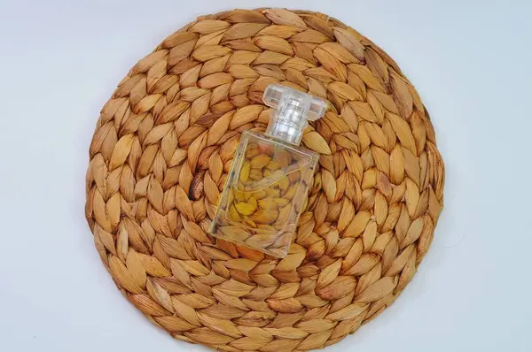 Wicker Placemat Bottle Perfume Light Background — Stock Photo, Image