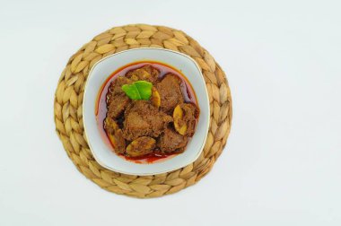 Rendang Jengkol, dogfruit simmered in spices and coconut milk. Indonesian traditional food, with a spicy savory taste typical of rendang and a legit jengkol texture clipart