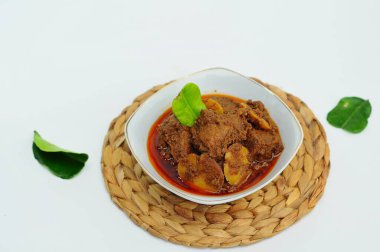 Rendang Jengkol, dogfruit simmered in spices and coconut milk. Indonesian traditional food, with a spicy savory taste typical of rendang and a legit jengkol texture clipart