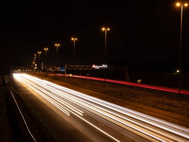 light painting using a low shutter speed for blurry light effects clipart