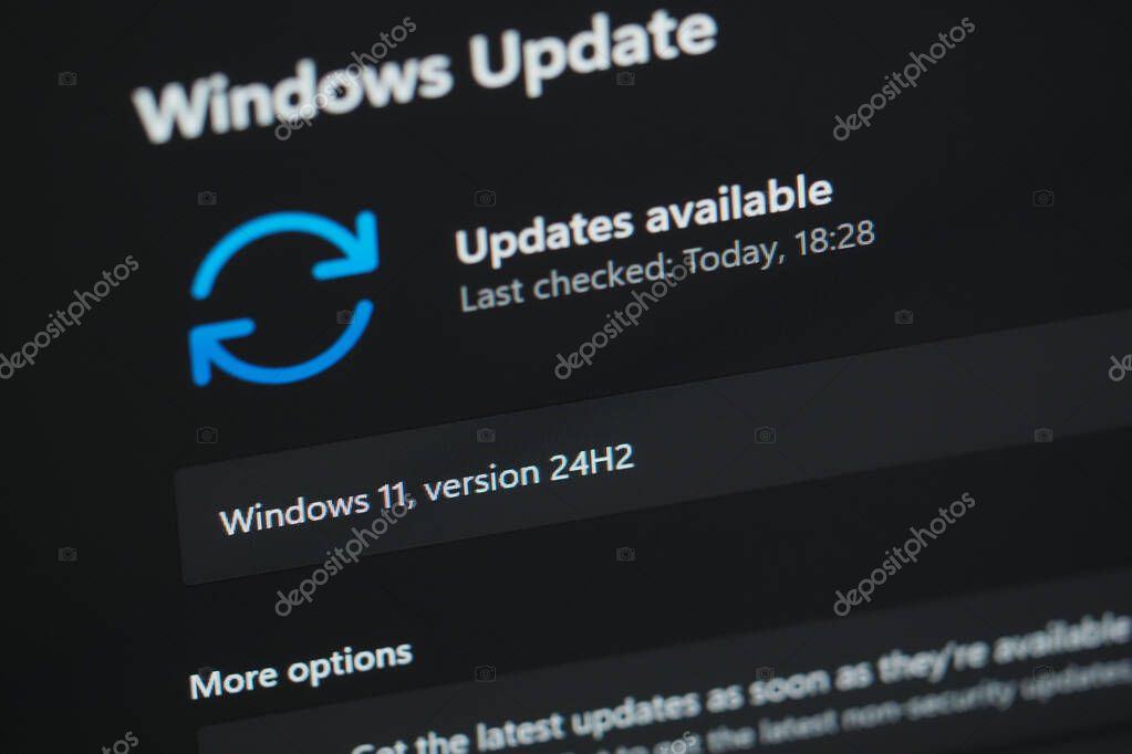 Galati, Romania - December 13, 2024: Checking for 24H2 Windows 11 updates on laptop screen close up view, focus on 24H2, 3:2 aspect ratio