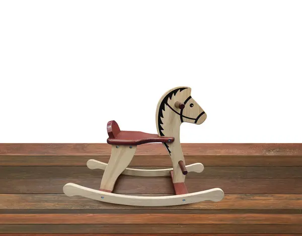 Rocking horse on wooden floor Isolated on a white background