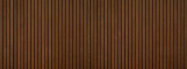 Uzun panoramik ahşap arka plan afişi - dikey kahverengi tahta akustik paneller.