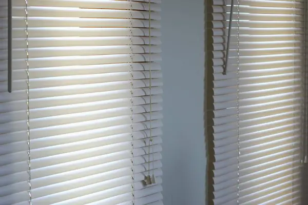 close up of a window with blinds