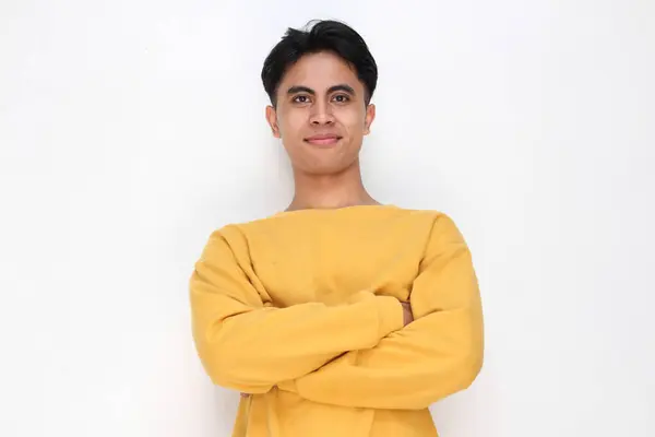 stock image young handsome   man over isolated white background with arms crossed 