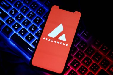 In this Photo Avalanche Avax Cryptocurrency logo is displayed on a smartphone screen clipart