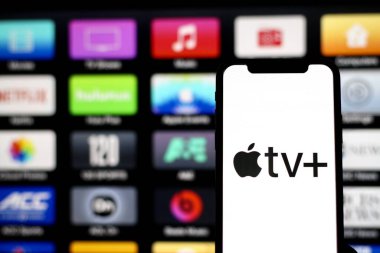 In this photo illustration, The logo of apple TV Plus is displayed on a smartphone screen.Indonesia - May 22th 2024. clipart