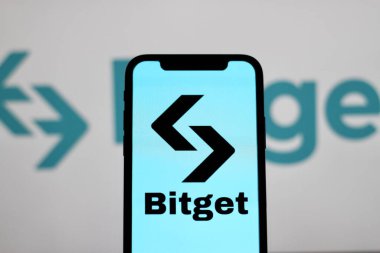 INDONESIA - JUNE 4TH, 2024: In this photo illustration,the logo of Bitget cryptocurrency, Bitget token,is displayed on a smartphone screen clipart