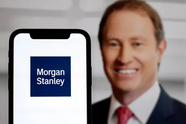 stock image In this photo illustration,The logo of Morgan Stanley with CEO Ted Pick in the background.indonesia - June 16th 2024.