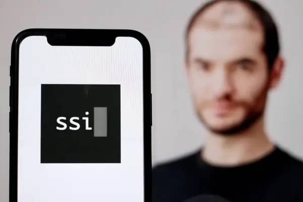 stock image In this photo illustration,the logo of Safe Superintelligence,SSI AI,is a new AI company with founder Ilya Sutskever in the background.indonesia - June 26th 2024.