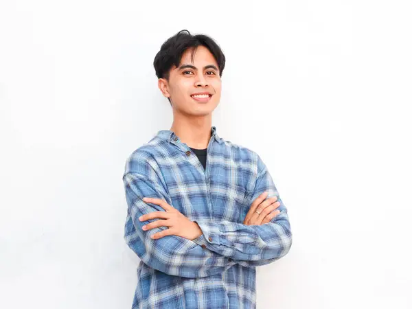 stock image portrait of young asian man posing in studio