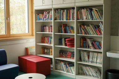 Schwabisch Gmund, Germany-November 12,2022: School library in a German school. High quality photo clipart
