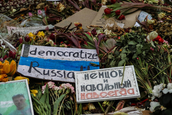 Berlin, Germany. March, 3rd, 2024. Memorial with  flowers and signs with the text Democratize Russia and Nemtsov and Navalny Forever in front of Russian Embassy in honor of politician Alexei Navalny.