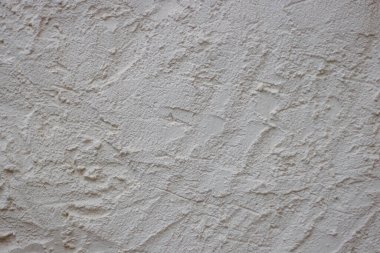 Çizik ve çatlaklarla dolu bir duvar parçası. Beton beton duvar dokusu ve üç boyutlu elementler. Modern tasarım. Retro grunge tarzı. Uzayı kopyala Duvar kağıdı, afiş, dokular, arkaplan