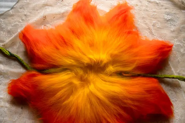 stock image Close up of felting wool layers texture. Gradient from yellow to bright orange colors. Sheep carded wool laid out for felt project. Wet felting craft. Textile art background. Top view. Copy space.