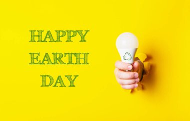 Sarı arkaplanda Mutlu Dünya Günleri. Ekolojik kavram. Yüksek kalite fotoğraf