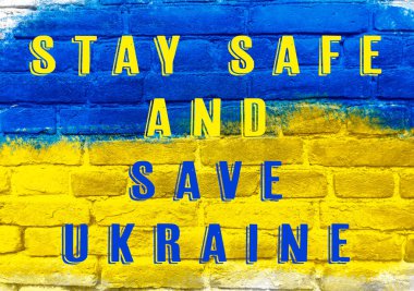 Ukrayna 'yı kurtarın yazan mavi ve sarı bir tabela. Tabela tuğla duvarda.