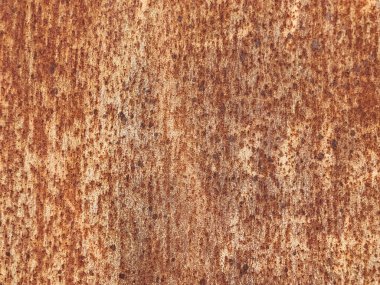 Bir sürü deliği ve pürüzlü dokusu olan paslı bir yüzey. Yüzey kahverengi ve o yaşlı.