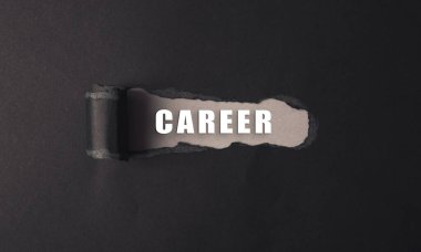 A black and white image of a torn piece of paper with the word career written on it. The torn paper suggests a sense of uncertainty or instability clipart