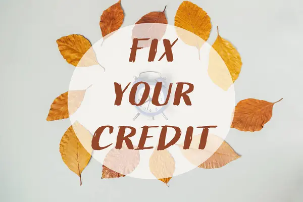 Stock image A circle of leaves with the words Fix Your Credit written around it