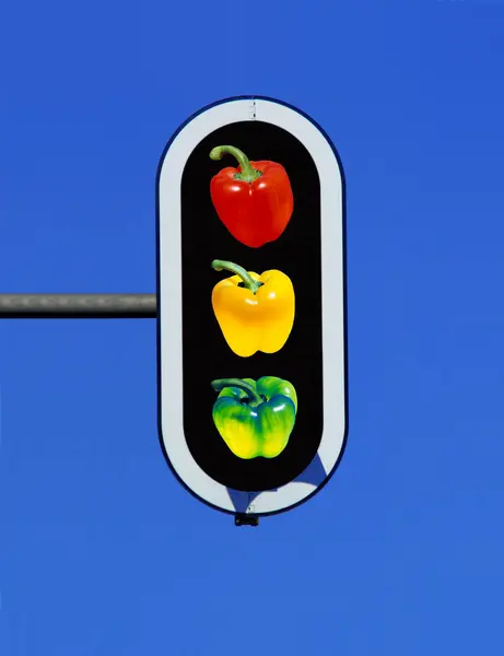 traffic light with three bell pepper, paprika in red, yellow and green