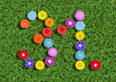 number written with colorful flowers on green background clipart