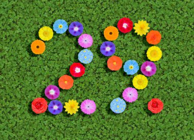 number written with colorful flowers on green background clipart