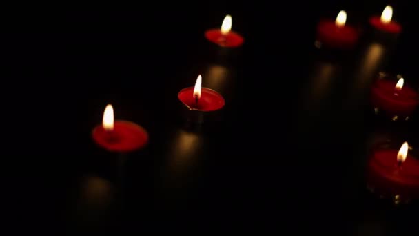 Burning Candles Dark Surface Memory Day Red Candles Glowing Dark — Stockvideo