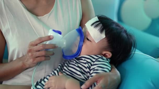 One Baby Mother Using Nebulizer Woman Hold Her Small Boy — Stock Video