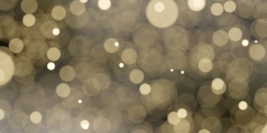 Yumuşak, bulanık bir arkaplan altın renkli bokeh ışıkları sıcak ve şenlikli bir atmosfer yaratıyor..