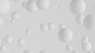 Açık gri bir zemin üzerinde yüzen beyaz kürelerin yer aldığı minimalist bir arkaplan animasyonu derinlik ve sükunet hissi yaratıyor..
