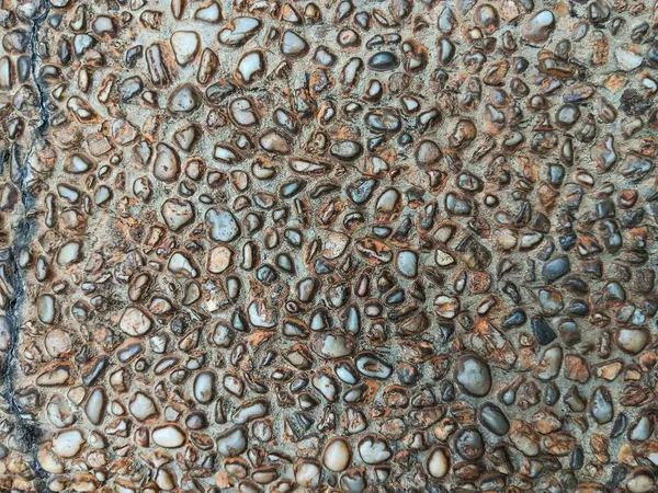 Peyzaj için çakıl taşlarıyla kaplı yüzeyin soyut dokusu.