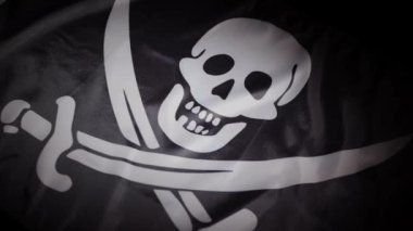 Jolly Roger ulusal korsan bayrağının dinamik dönüşü. Yüksek kalite 4k görüntü