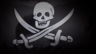 Jolly Roger korsan bayrağı dalgalanır ve dalgalanır. Yüksek kalite 4k görüntü