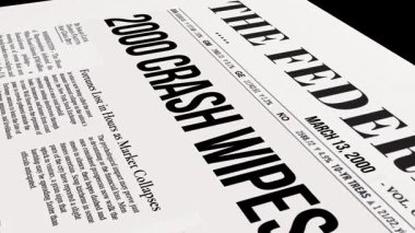 Bu, federal rezerv ile ilgili manşetlerin yer aldığı ve önemli finansal haberlerin yer aldığı bir gazetenin detaylı yakın plan görüntüsü.