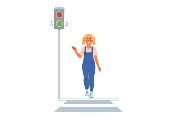 Trafik ışığı yaya geçidi boyunca yürüyen küçük kız için yeşil sinyal gösteriyor. Çocuk şehirde dolaşırken yol kurallarını izler ve trafik ışıklarının hareketin başlamasına izin verdiğine işaret eder