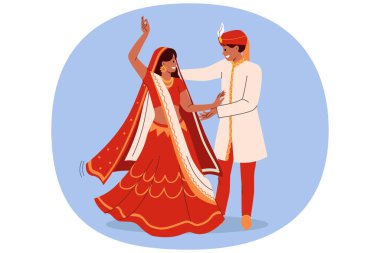 Hintli çift, geleneksel Hint kültürünü icra ederek, ulusal kıyafetlerle düğün dansı yapıyor. Hintli gelin ve damadın düğün seremonisi yeni bir aile kurma sevinci ile