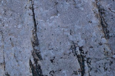 Taş dokusu arka planı. Doğal taş yüzeyini çatlaklarla kapatın..