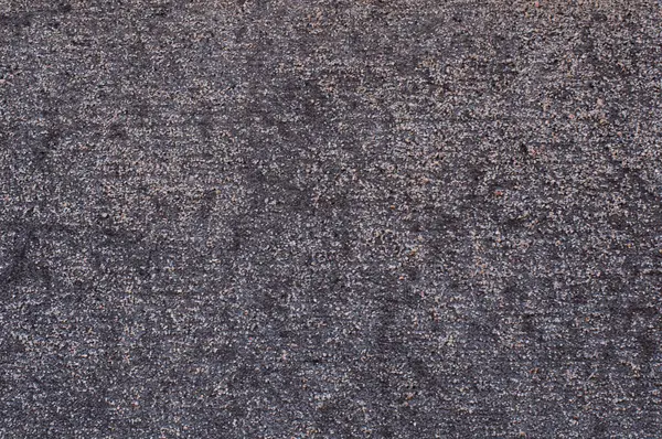 close-up of a background with a small pattern of gray specks.