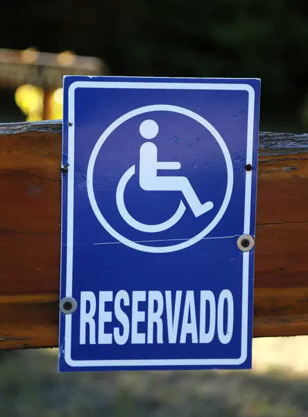Poster for a position reserved for disabled people. Wheelchair person sign.