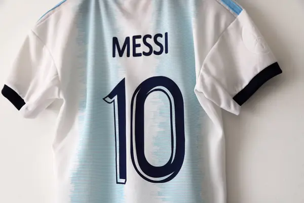 stock image Argentina soccer jersey. Lionel Messi shirt. Number 10. light blue and white. AFA logo. Argentine Football Association. Adidas. Shield. Soccer player. T-shirt.