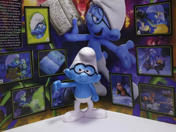 stock image The smurfs. Philosopher. Little blue creatures that live in mushroom houses in the woods. Television characters, movies and comics. Album of figurines or stickers.