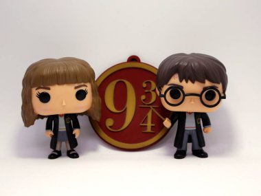 Harry Potter and Hermione Granger Funko pop. Toys for kids. Characters of the movies of Harry Potter. Hogwarts School. Platform 9 3/4 of the Hogwarts Express train. Characters from the books of J. K. clipart