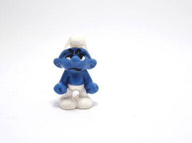The smurfs. Grumpy Smurf. Little blue creatures that live in mushroom houses in the woods. Television characters, movies and comics. Blue creatures. Angry smurf. clipart