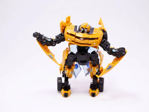 stock image Bumblebee. Yellow Transformers. Transformers cars. Cars that transform into robots. Transforms movie. Toy cars for children. Autobot. Machines. Yellow.