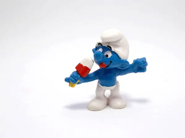 stock image The smurfs. Sweet smurf. Little blue creatures that live in mushroom houses in the woods. Television characters, movies and comics. Blue creatures. Ice cream. Popsicle stick.